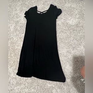 Black dress with crossed back. Size medium, never worn.